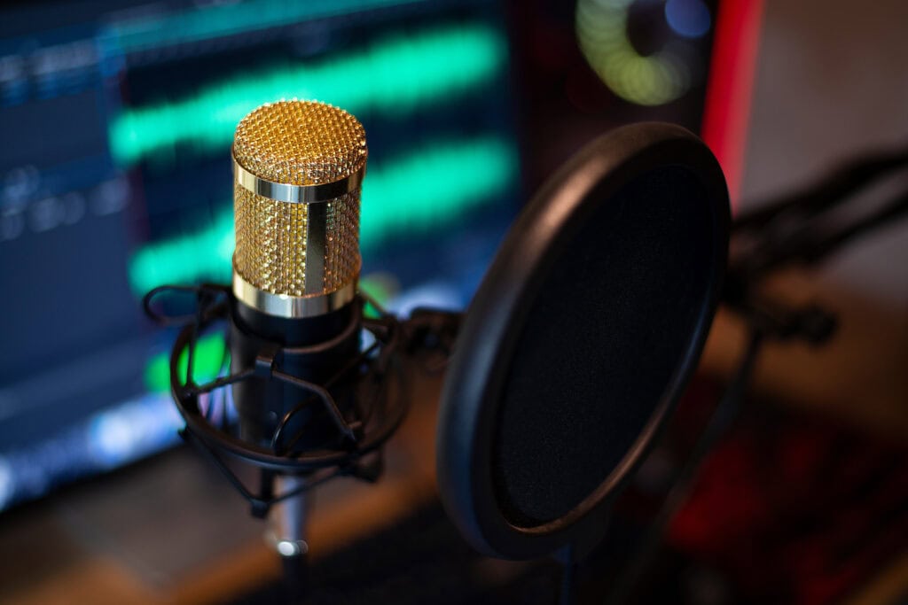 Golden microphone at audio recording, On computer